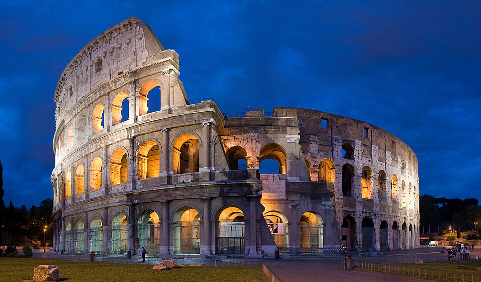 Italy's Colosseum lights up the evening sky. 