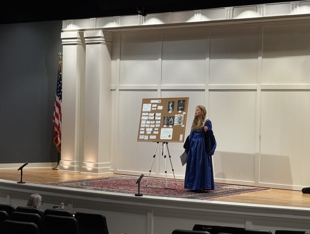 Anne speaking with judges at the state competition.